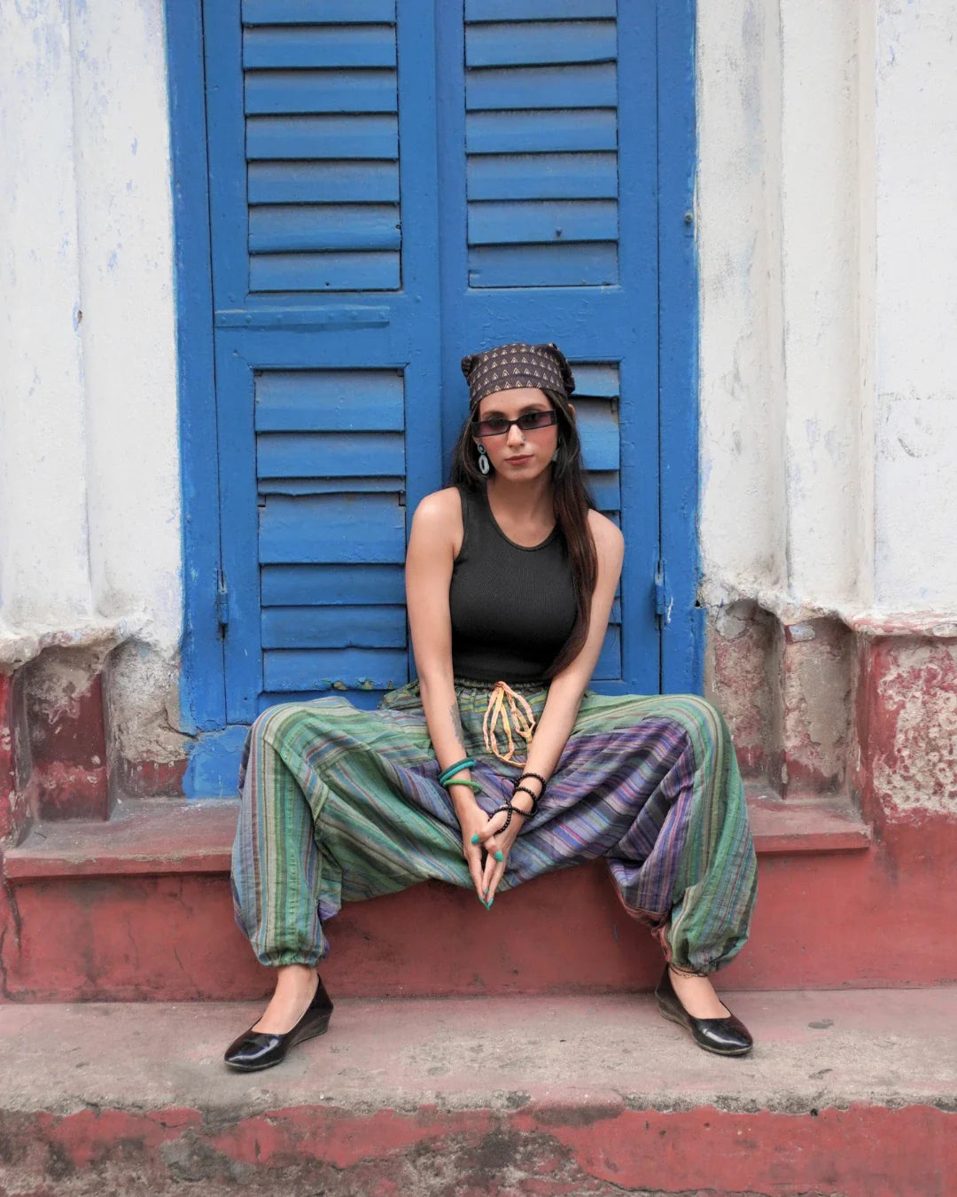 indie breeze green harem pants female sitting