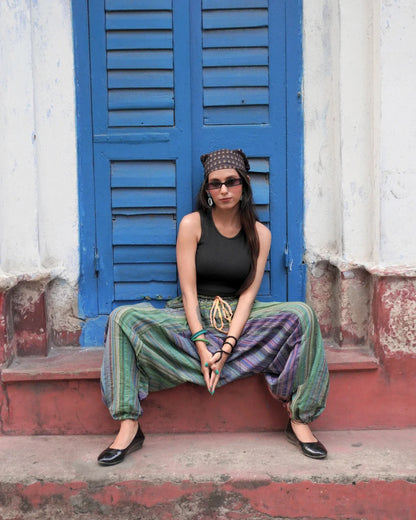 indie breeze green harem pants female sitting