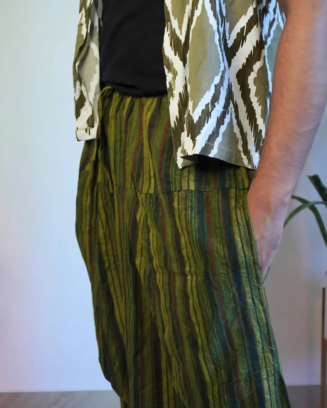 Close-up showing fabric detail of Jungle Nomad Green Harem Pants